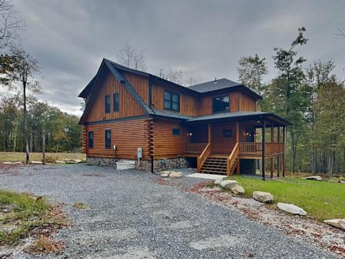 a large wooden house with a gambrel roof at Golden Crest in McHenry