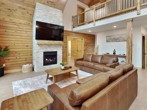 a living room with a couch and a fireplace at Golden Crest in McHenry