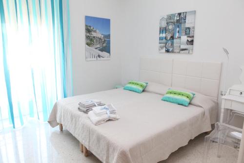 Ένα ή περισσότερα κρεβάτια σε δωμάτιο στο B&B Palazzo Scaramella