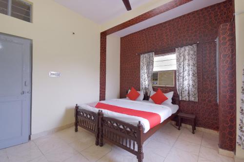 Ліжко або ліжка в номері Hotel O Aditya