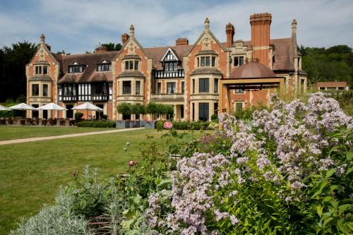 a large house with flowers in front of it at The Wood Norton in Evesham