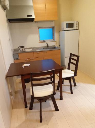 Η κουζίνα ή μικρή κουζίνα στο K,AND,M,OOIMACHI - Vacation STAY 60966v