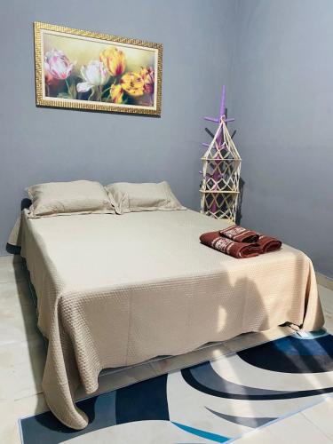 Katil atau katil-katil dalam bilik di Casa Aconchegante em Nova Iguaçu