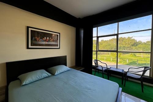 Voodi või voodid majutusasutuse Luxury Studio Apartment in B-17, MULTI GARDEN toas