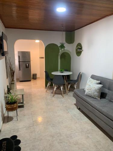 a living room with a couch and a table at La casa de Fefa in Ríohacha