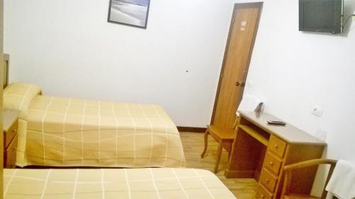 Hostal El Cairoにあるベッド