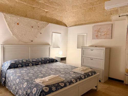 Postel nebo postele na pokoji v ubytování Baia Sangiorgio Hotel & Beach Club