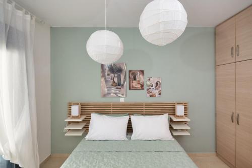 a bedroom with a bed with two white pillows at Anna Maria Suite in Rhodes Town