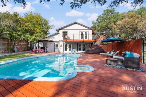 a house with a swimming pool on a wooden deck at Pet Friendly 3BR 3BA Hill Country Home w Private Pool and Grill by Austin Vacay in Buffalo Gap