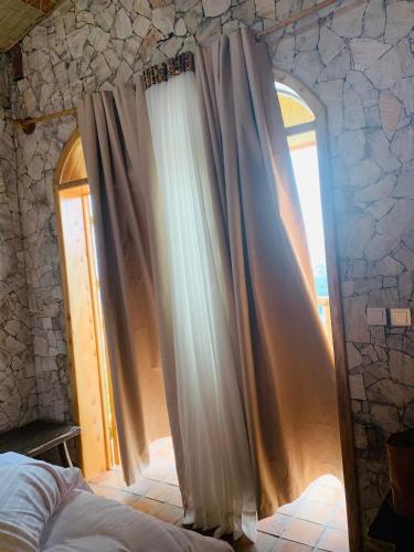 Gulta vai gultas numurā naktsmītnē Kitabi EcoCenter