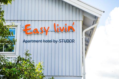 a sign on the side of a building at Easy Livin' Apartment Hotel in Växjö