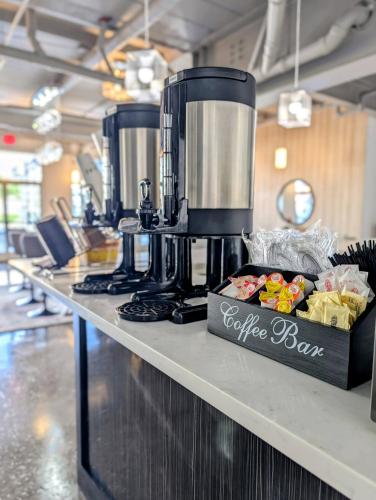 a coffee bar with a coffee maker on a counter at SOHO Suites Atlantic City Beach Block in Atlantic City