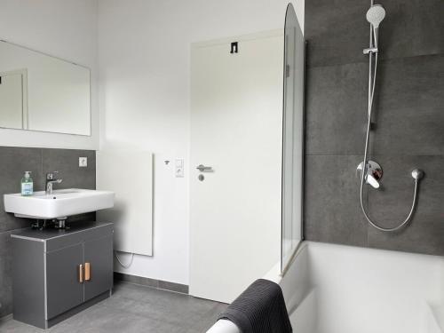 a bathroom with a shower and a sink at 2 bedroom apartment with 4 beds in Pfaffenhofen PAF01 in Pfaffenhofen