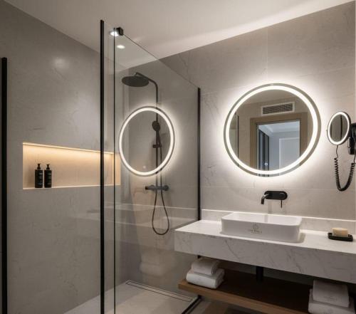 a bathroom with a sink and a mirror at THE PERLA Bodrum HOTEL in Bodrum City