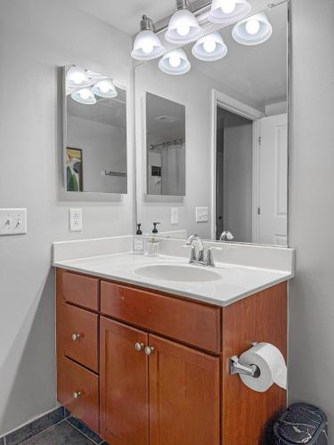 a bathroom with a sink and a mirror at The Stay 2 - Navy Yard Washington DC in Washington, D.C.