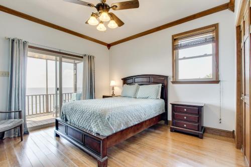 a bedroom with a bed and a window at Private Beach and Views! Stilted Ocean Springs Home in Gulf Park Estates