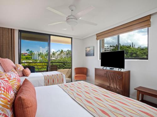 En eller flere senge i et værelse på Polo Beach Club 609