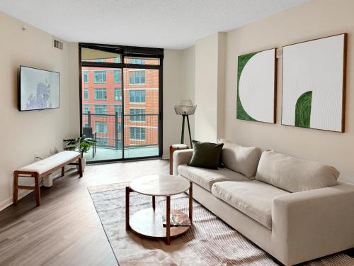 a living room with a couch and a table at The Stay 2 - Navy Yard Washington DC in Washington, D.C.