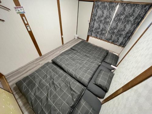 枚方市にあるHirakata - House - Vacation STAY 20200のベッド1台が備わる客室です。