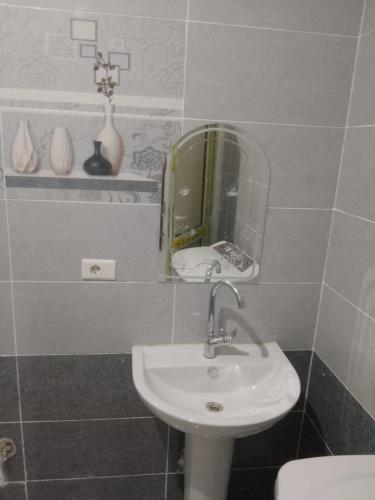 a bathroom with a sink and a mirror at Melia house in Marsa Alam City