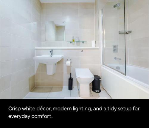 a bathroom with a toilet and a sink and a shower at X1 Humble Abode in Manchester