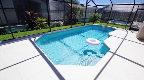a frisbee is in a swimming pool at Rocco's Retreat in Orlando