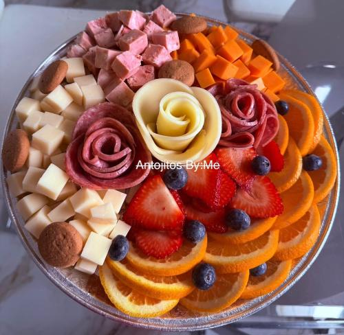 a platter of fruit and vegetables on a table at Campo Adentro Cabin 2 Private Jacuzzi in Aguada