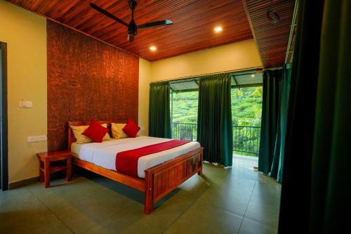 a bedroom with a bed and a large window at Private Pool Villa by Green View in Vythiri