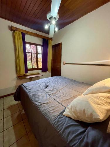 a bedroom with a large bed in a room at Rincón verde in Eldorado