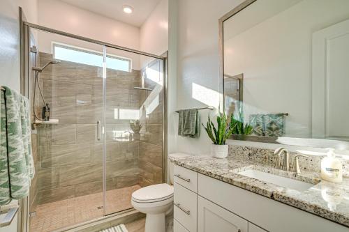 a bathroom with a shower and a toilet and a sink at Mtn Views and Private Hot Tub Buckeye Getaway in Perryville