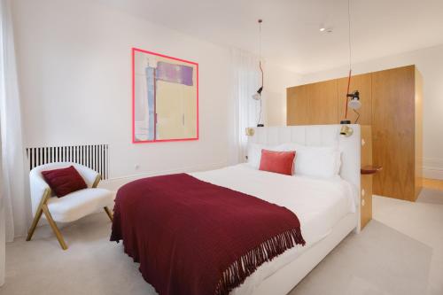 En eller flere senge i et værelse på City Retreat by Reframe stay in Porto