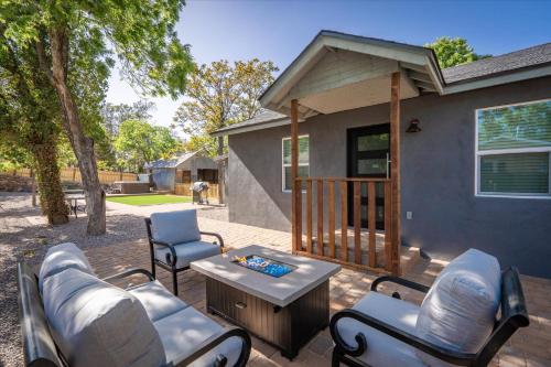 a patio with a couch and chairs and a table at Old Town Stunner in Cottonwood