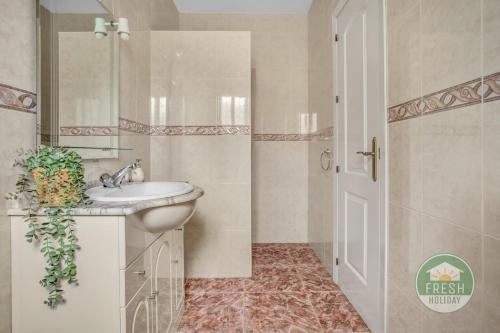 a bathroom with a sink and a mirror at Casa del Barco Villa with Private Retreat Vibes in Guaro