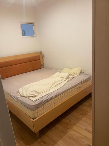 a small bedroom with a bed in a room at Schwavillage in Schwadorf