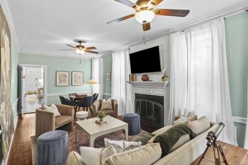 a living room with a couch and a fireplace at The Verdigris| 1800s Charm| King St| Easy Parking in Alexandria