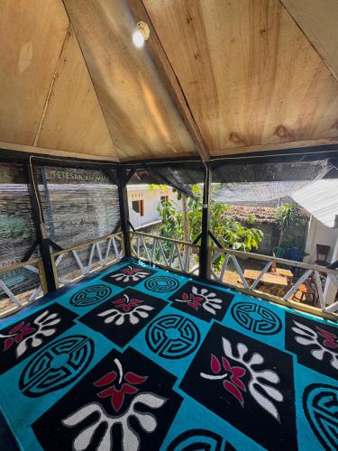 a view from the inside of a boat with a painted floor at Gina's Reading Homestay in Pulau Lebur