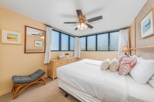 a bedroom with a bed and a ceiling fan at Polynesian Shores 111 · PS 111 Updated Condo w Ocean Views Pool in Kahana