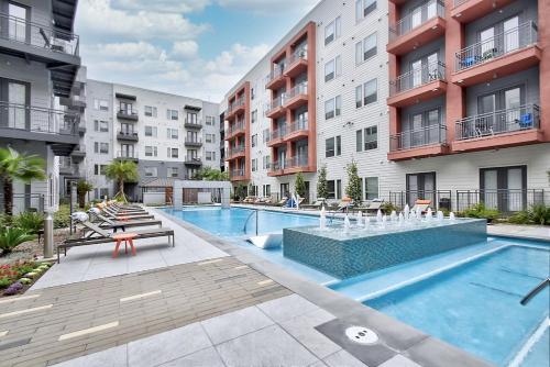 an image of a swimming pool in a apartment complex at One Bedroom Luxury Apartment - Fast Wi-Fi - FREE Parking in San Antonio