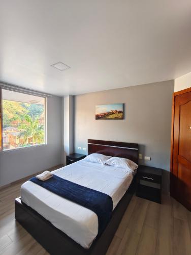 a bedroom with a large bed and a window at Zamora Suite GM Luxury in Zamora