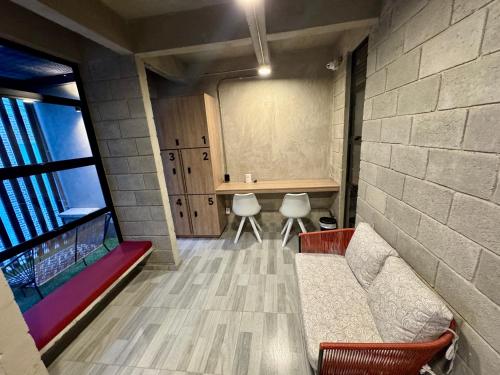 a living room with a couch and a window at Our Home Granada in Cali