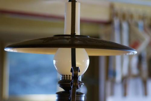a close up of a lampshade on a light fixture at Posthotel Rössli in Gstaad