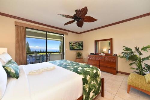 a bedroom with a bed and a ceiling fan at Kapalua Golf Villas 19T6 · KGV 19T6 Updated 2BD Kapalua Panorami in Kahana