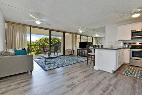 a kitchen and living room with a couch and a table at Kihei Alii Kai A207 · KAK A207 Renovated Kihei Condo Near Beach in Kihei