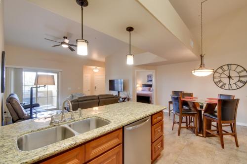 a kitchen with a sink and a table with chairs at 8 Mi to Tonto Natl Forest Desert Oasis with Pool in Mesa