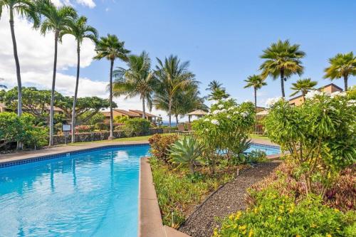 a swimming pool at a resort with palm trees at Wailea Ekahi 40E · WEK 40E Dream Getaway w AC Pools Beaches Golf in Wailea