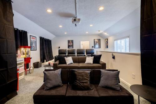 a living room with a couch and a living room at Movie Theater-Game Room-Parking-Heart Of Cleveland in The Angle