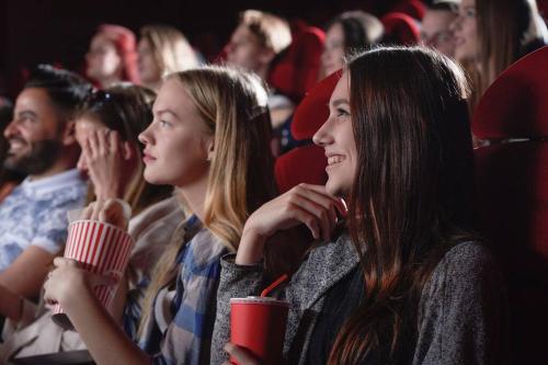 a group of people sitting in a movie theater at Movie Theater-Game Room-Parking-Heart Of Cleveland in The Angle