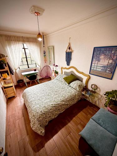 a bedroom with a bed and a desk in it at Lovely cozy & spacious room in heart of Condesa in Mexico City