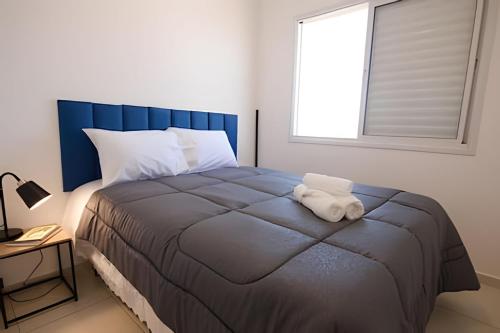 En eller flere senge i et værelse på Acqua Village