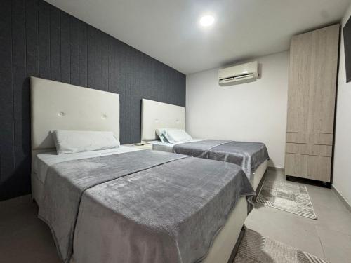 Ένα ή περισσότερα κρεβάτια σε δωμάτιο στο HOTEl SAN ANTONIO ZONA TURISTICA